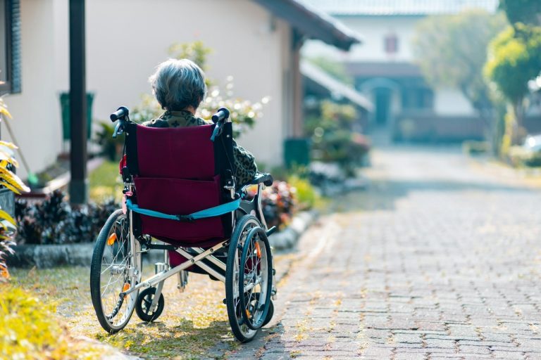guzz-elderly-on-wheelchair--zBsdRTHIIm4-unsplash