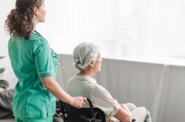 citiio-side-view-nurse-pushing-disabled-patient-wheel-chair_23-2147861489